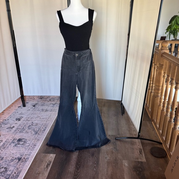 Free People Denim - Free people black bell bottoms raw cut.